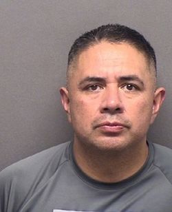 Alfred Flores booking photo